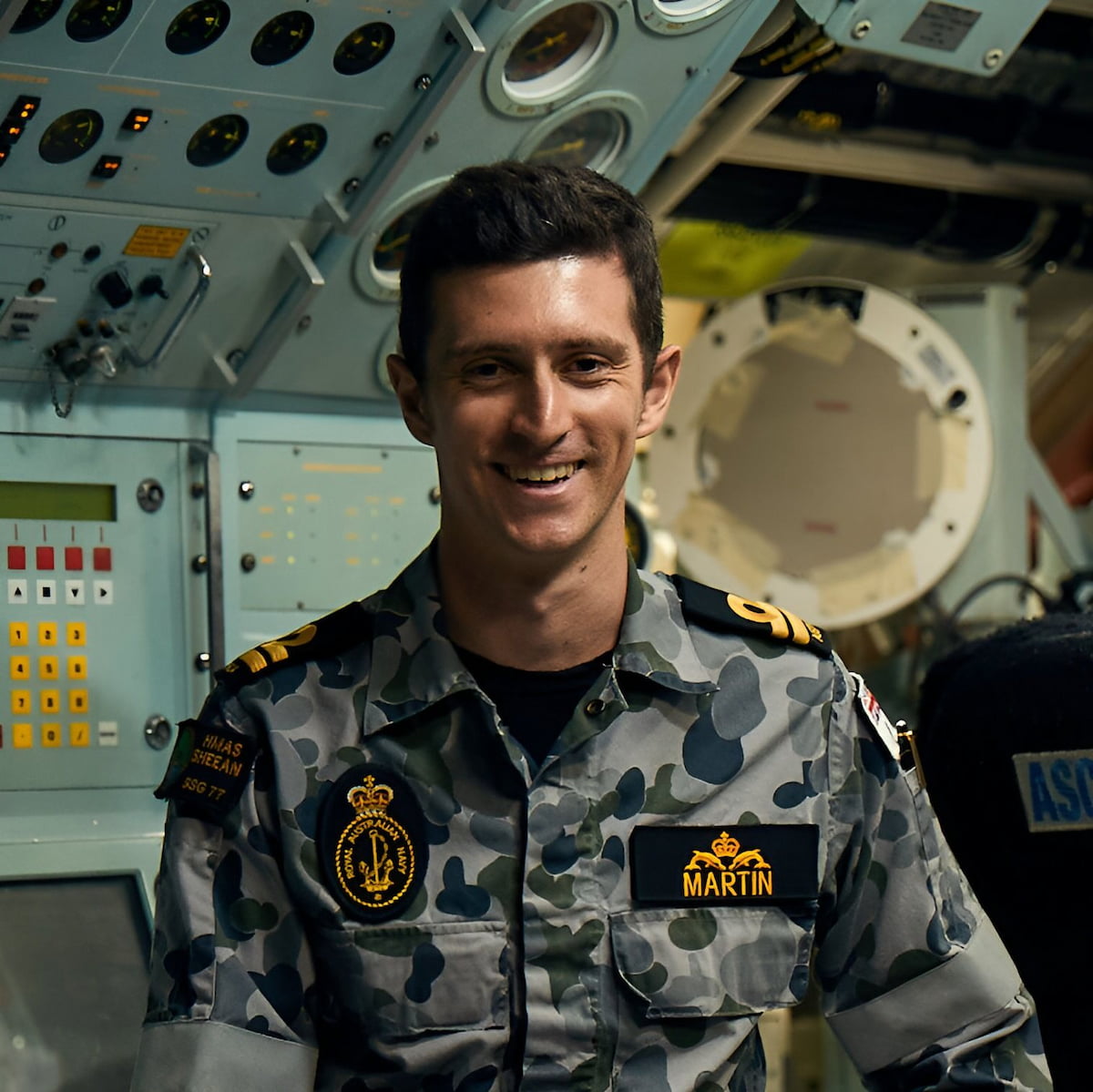 Navy Submariner Gerard smiles at camera.