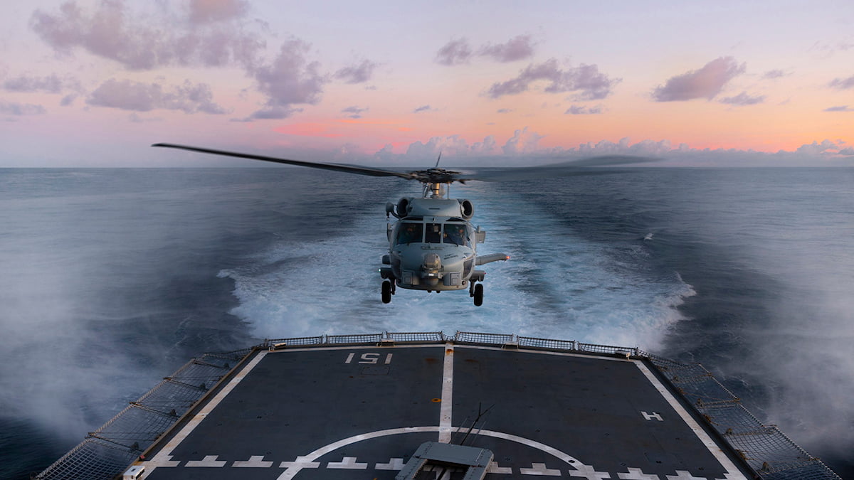 helicopter landing on an aircraft carrier.