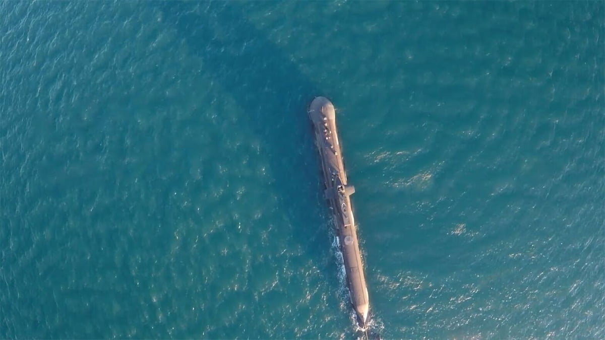 Aerial view of a submarine floating on water.