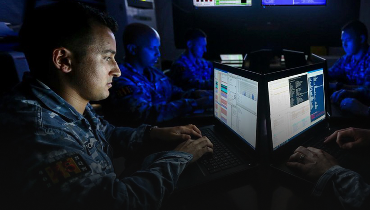 A member of the Air Forces monitors data on a computer screen.