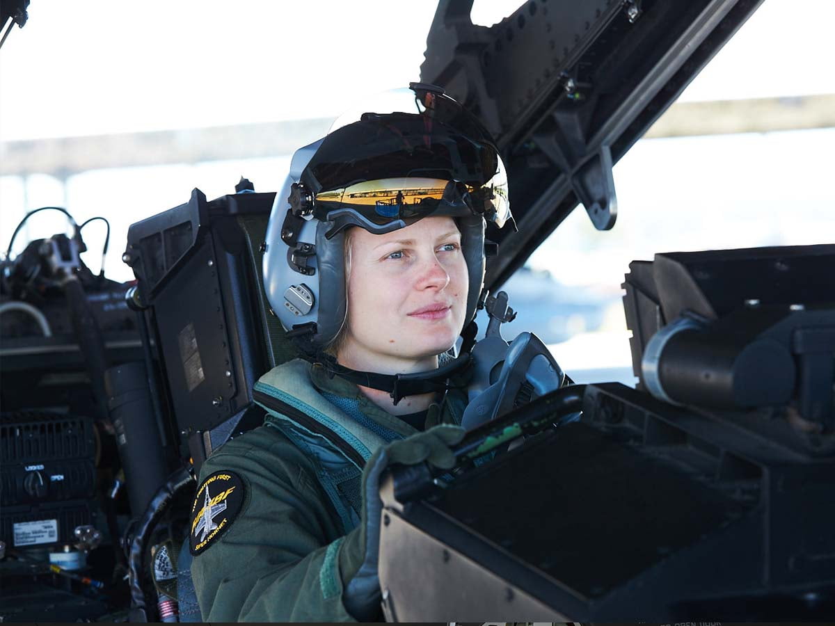 A female pilot is ready for take off.