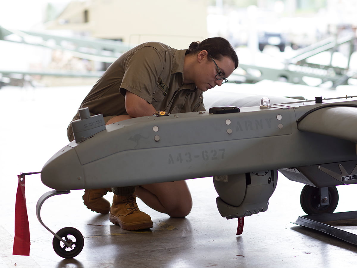 A member of the Army works on equipment.