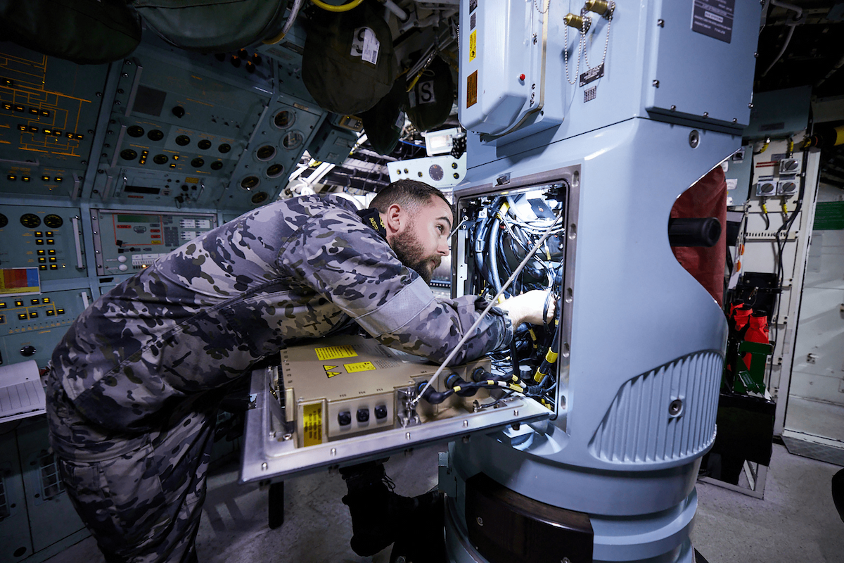 An Air Force mechanic is working on some equipment.