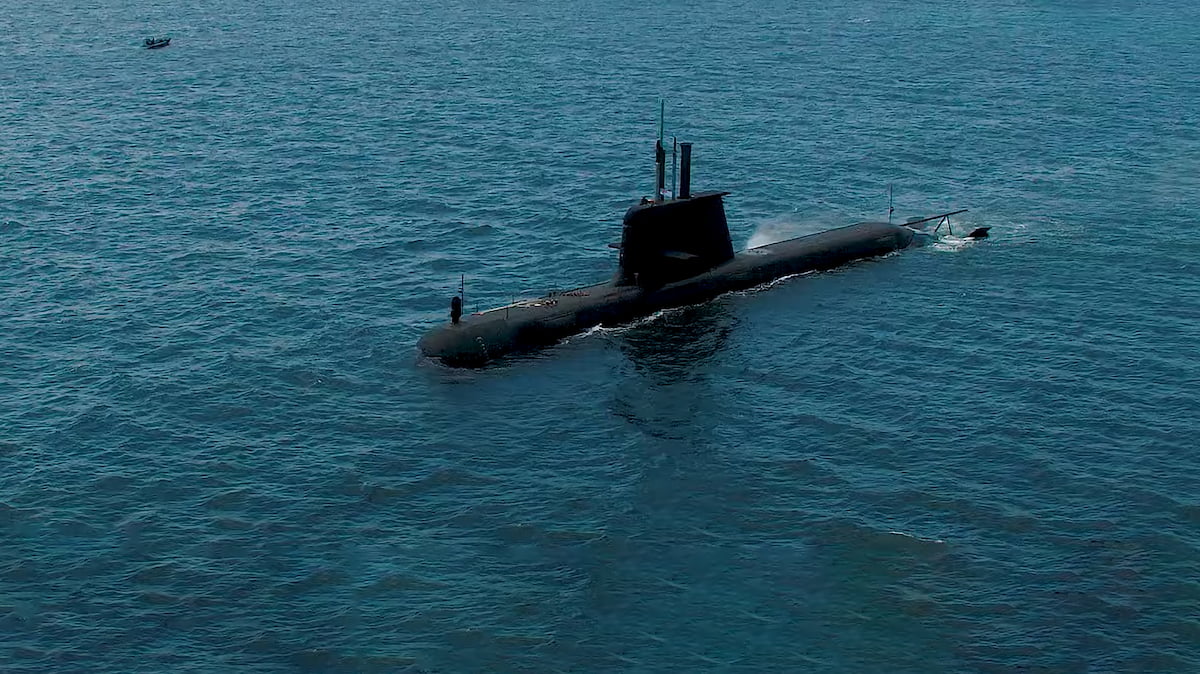 Submarine floating on water.
